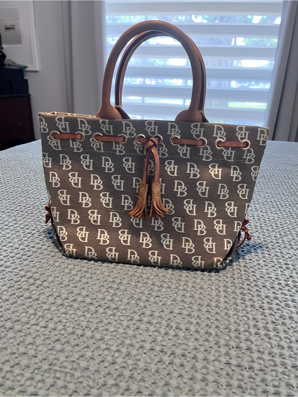 Dooney & Bourke Brown and Cream Logo Tote with Leather Tassels